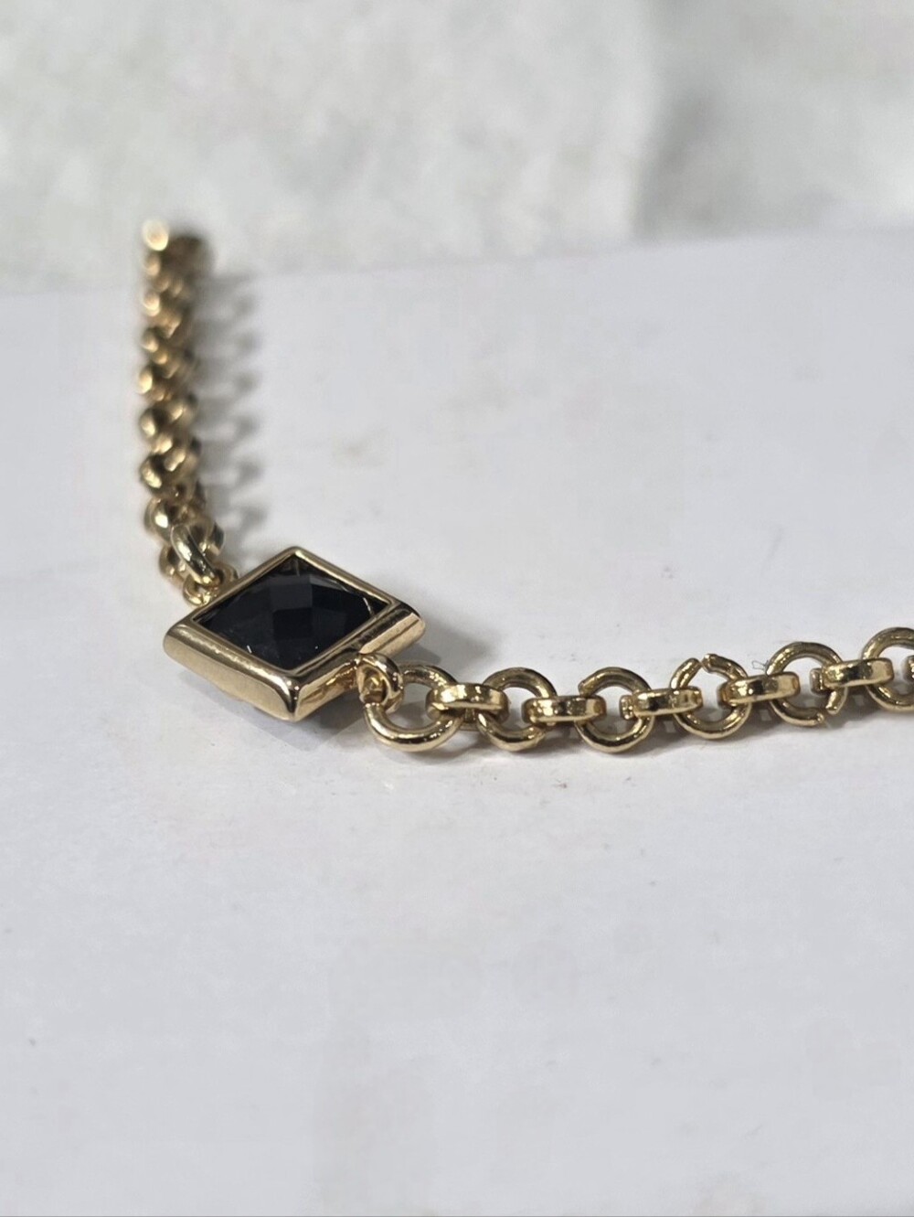 Elegant Gold Chain Bracelet with Black Faceted Stone
